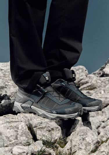 Hiking shoes on rock at altitude
